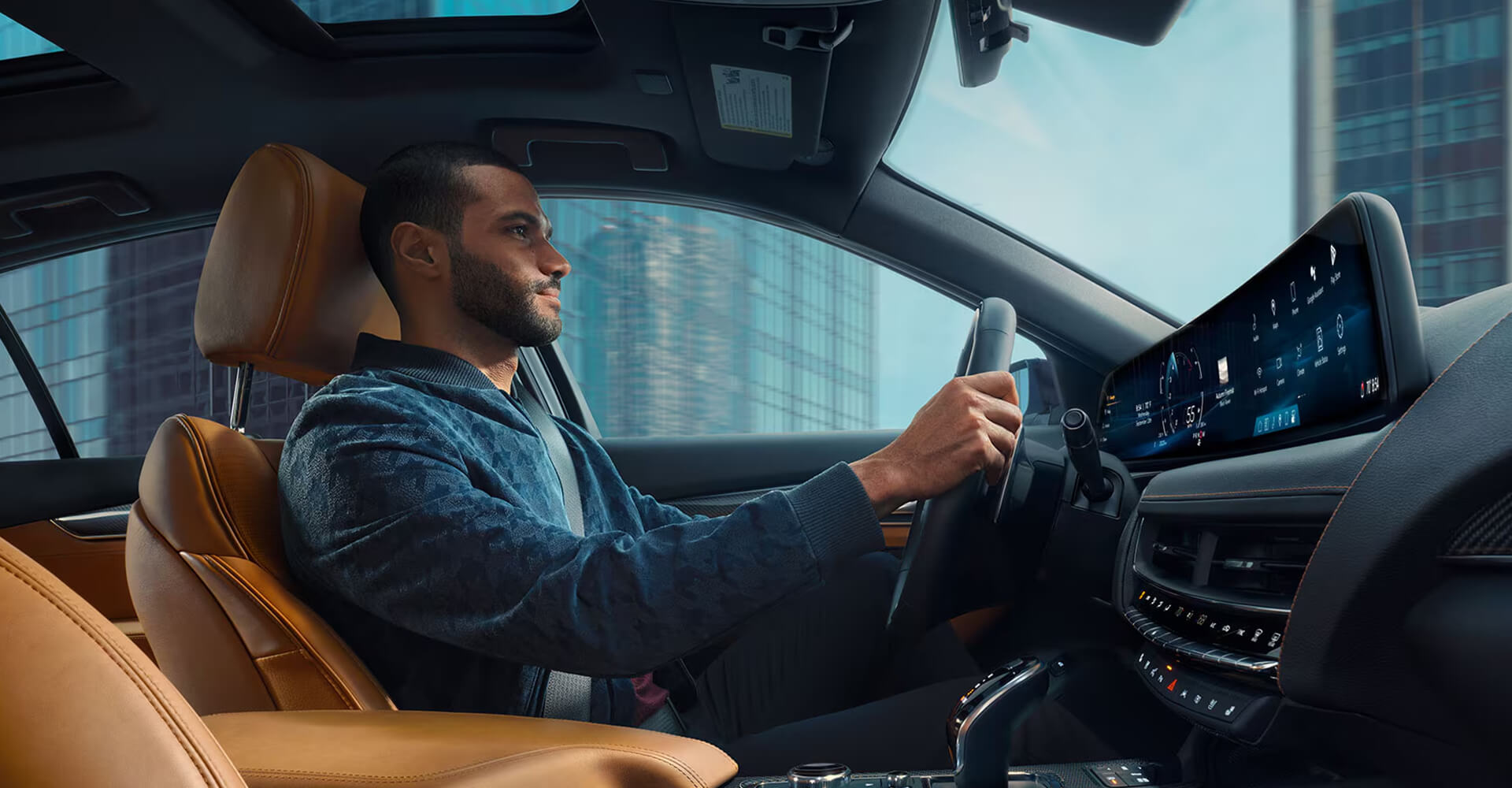 Cadillac service technician working on vehicle